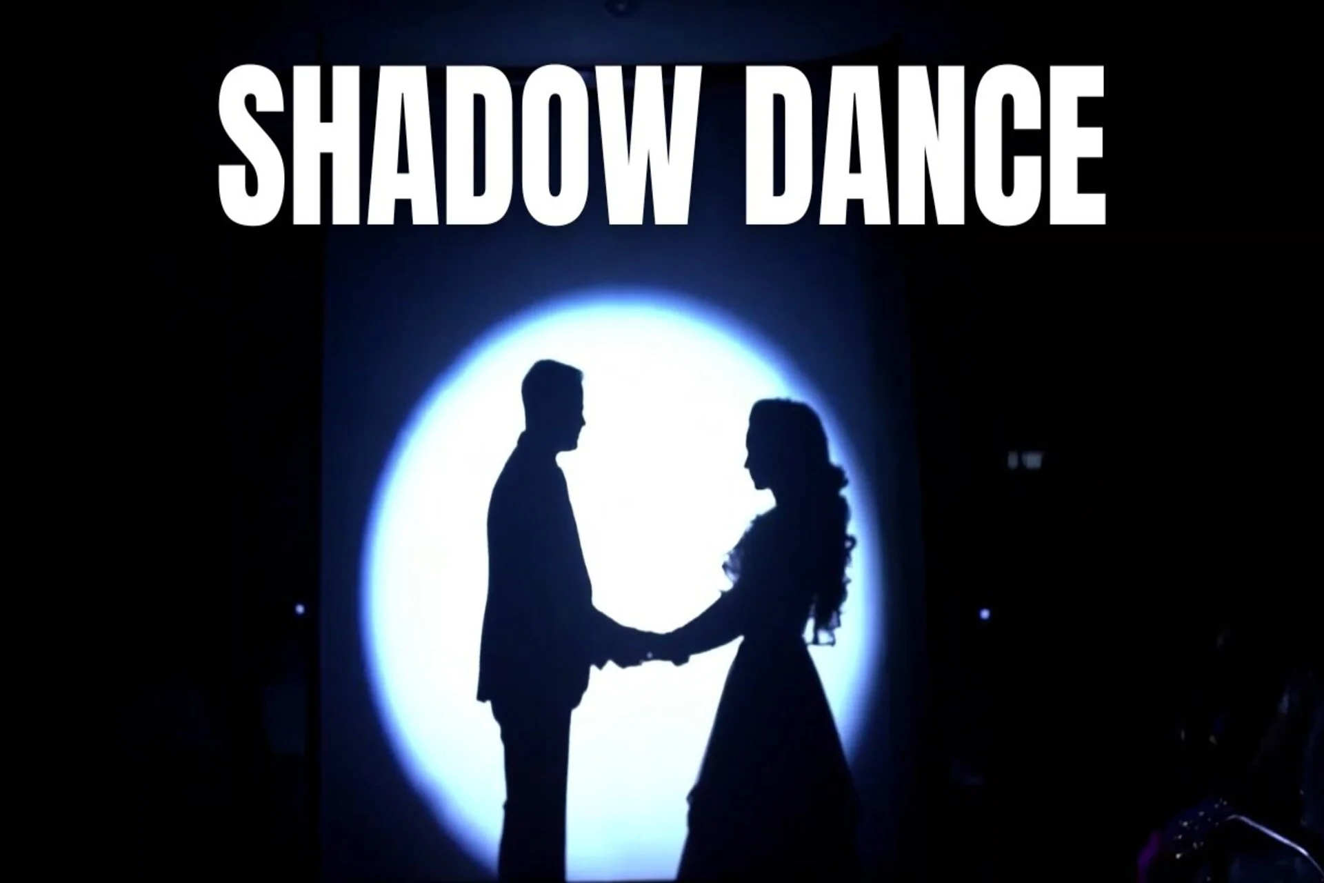 shadow dance silhouette performance Sangeet wedding 2026 India backlit stage