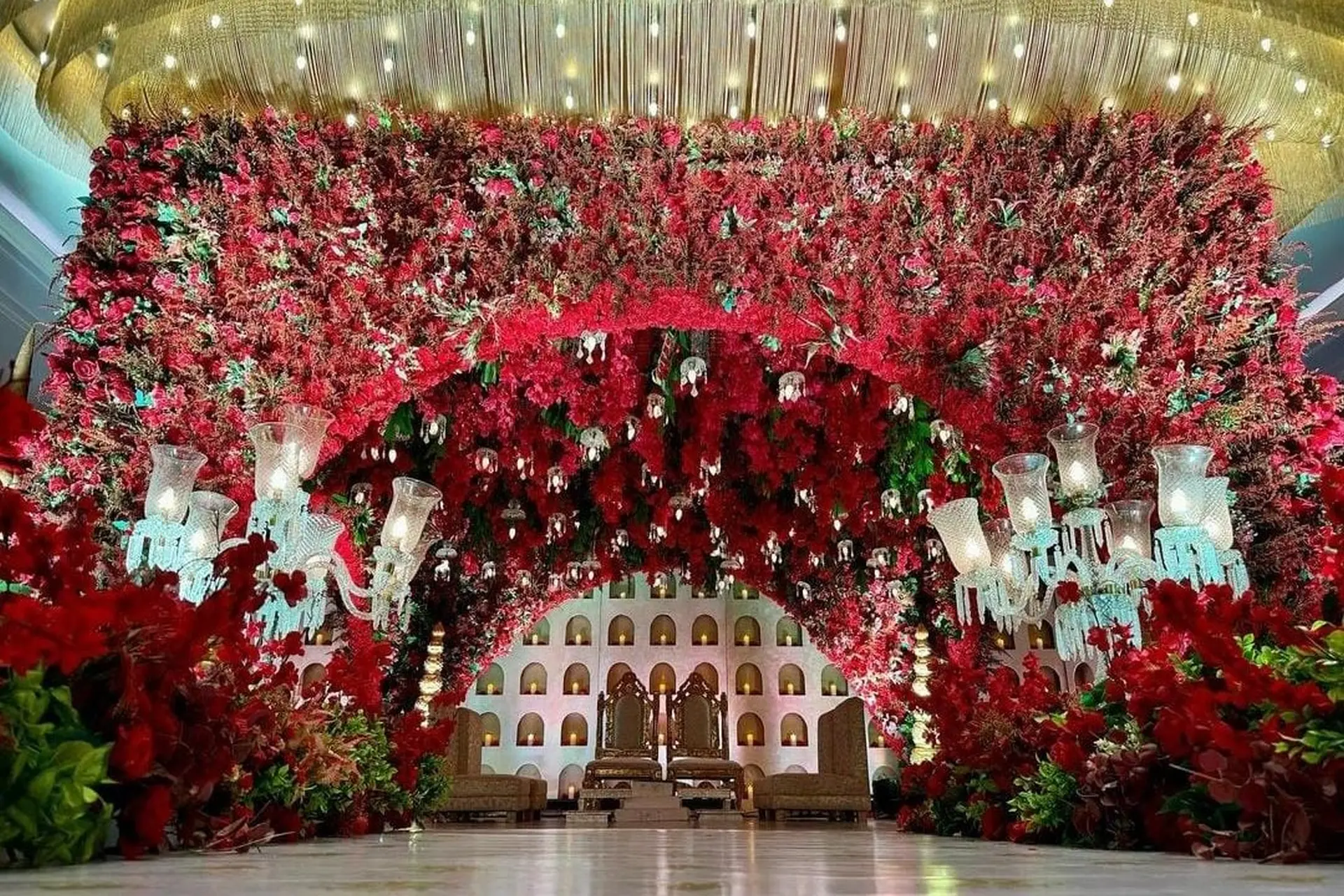Red Floral Mandap Decor by Deluxe Decorators