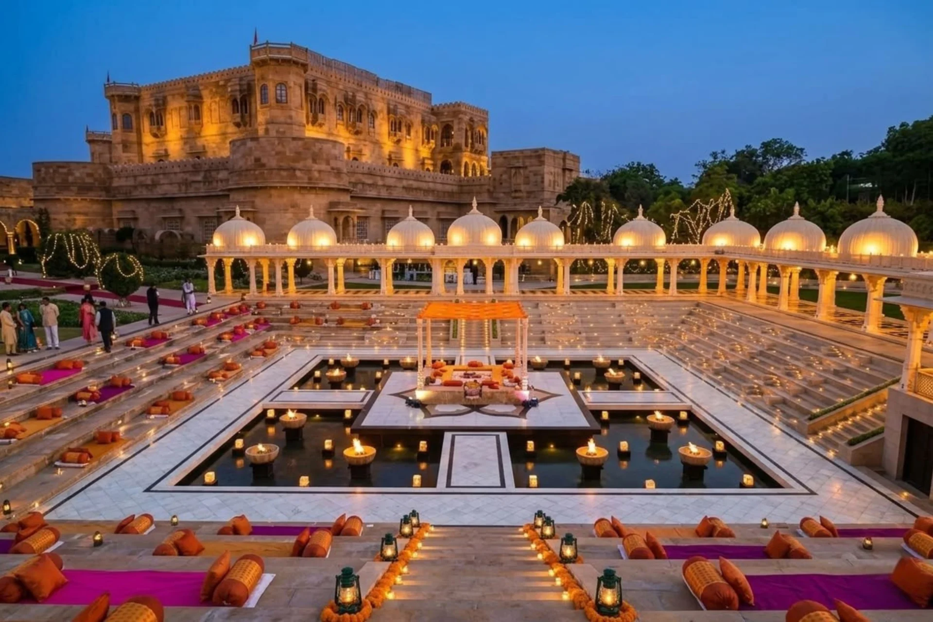 Indian wedding banquet hall with round-table seating layout for 300 guests, decorated with marigold centrepieces