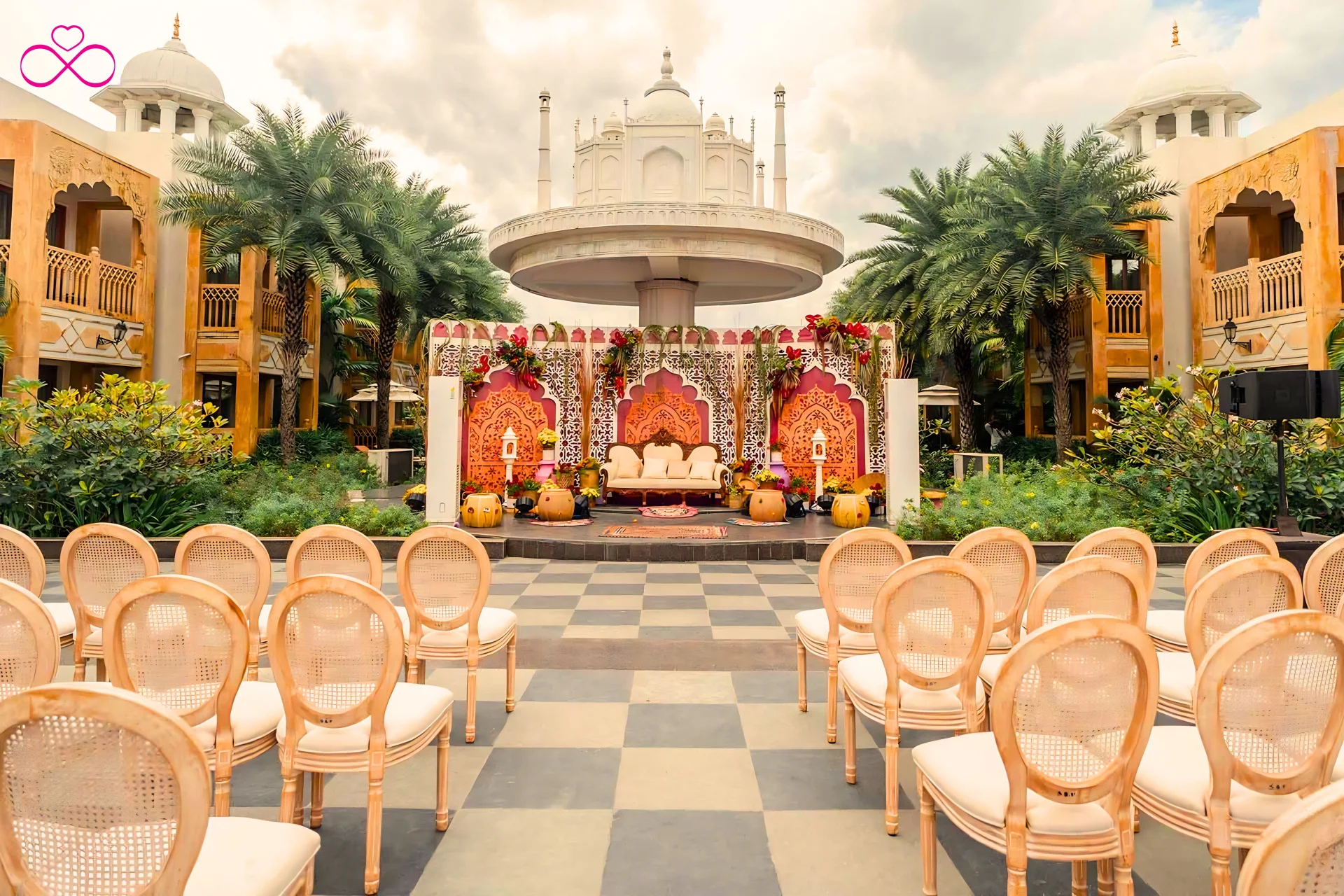 Mughal garden mehendi ceremony theme decor 2026 arched backdrop ivory gold Indian wedding