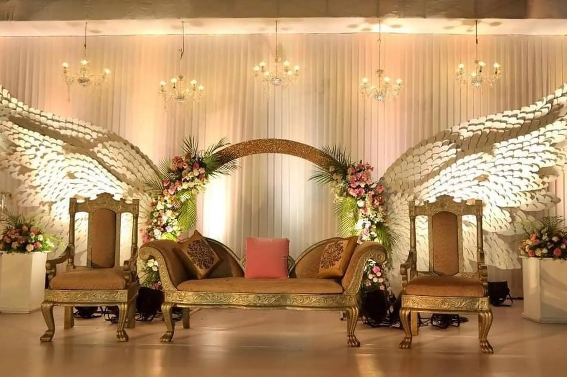 Wedding Reception Stage carved with Wings Decor by Sanj Events & Entertainment