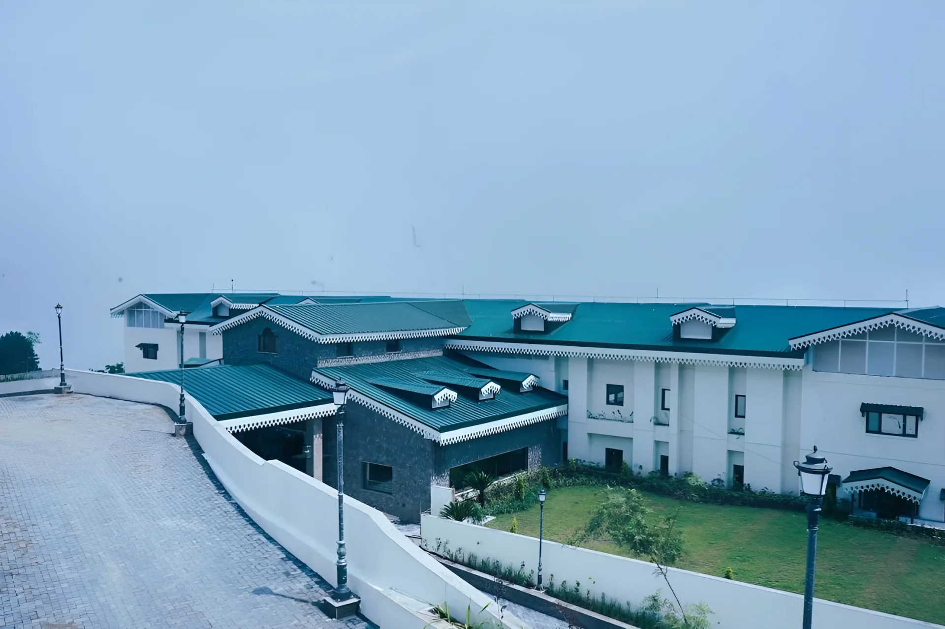 Aurika Naldehra Shimla luxury mountain wedding resort exterior with pine forest and valley views Himachal Pradesh