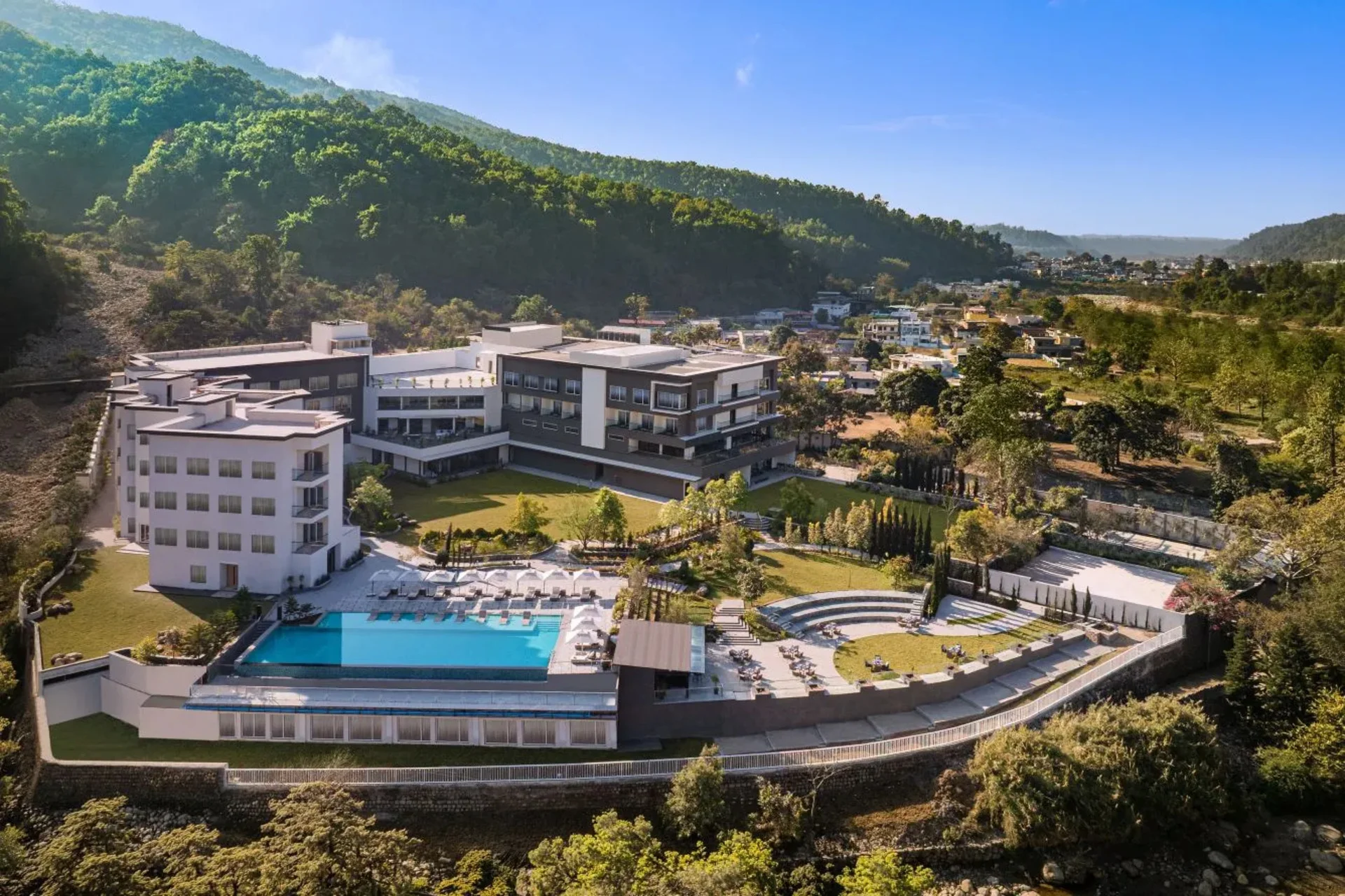 Le Méridien Dehradun Resort and Spa exterior view with Himalayan backdrop